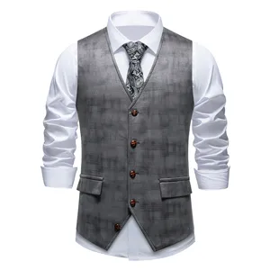 Men's grey patterned suit vest detail, classic waistcoat design, elegant formal wear accent.