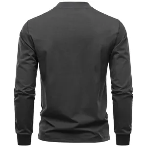 Detail view of men's slim fit long sleeve dark grey casual top showing back construction.