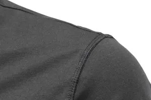 Close-up detail of the shoulder seam on a men's casual cotton blend slim long sleeve t-shirt.