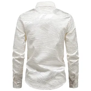 Detail shot of men's white pleated long sleeve shirt with unique leaf texture, casual autumn style.