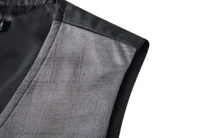 Detailed view of men's suede patchwork suit vest, showing fabric texture and fine stitching.