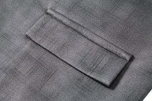Men's faux suede suit vest detail view, featuring textured fabric and classic pocket design.
