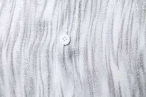 Men's casual long sleeve shirt fabric detail view with distressed marble print pattern