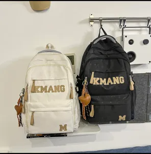 Detailed view of the casual student backpack with large letter print and large capacity.