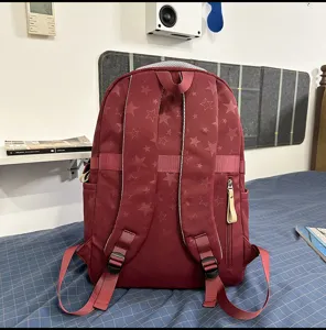 Detailed view of red star pattern backpack casual travel daypack large capacity rucksack