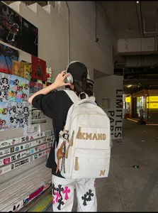 Vintage large capacity student school backpack with letters, casual travel daypack for daily.
