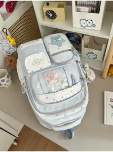 Japanese cute star backpack detail shot showing multi-pocket design and lovely star plush pendant.