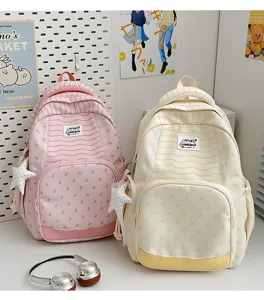 Zaino per studenti stampato di grande capacità con ciondolo a stella e design a righe.
