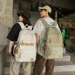 Large capacity casual student backpack with vintage letter design for men and women daily travel.