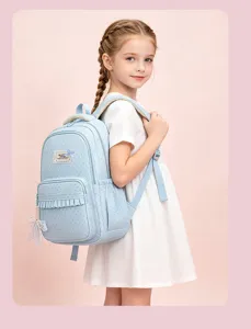 Light blue polka dot school backpack detail, stylish and cute casual daypack for kids.