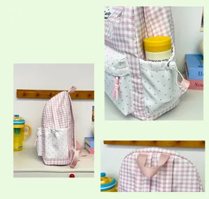 Korean style sweet pink plaid backpack detail shot showing side pocket and top handle.