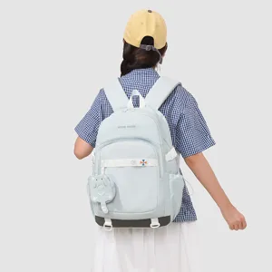 Sac à dos scolaire bleu clair pour filles grande capacité avec charmant pendentif chat.