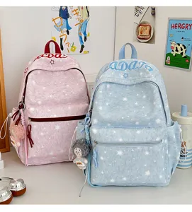 Cute star pattern school backpack set with plush pendant in pink and blue colors for daily use.