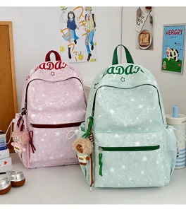 Casual printed star pattern student school backpack with cute plush charm for daily commuting.