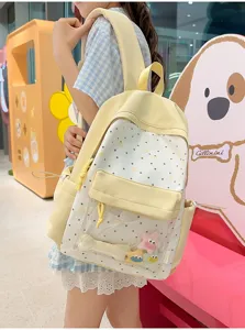 Detail view of the sweet Japanese style backpack with clear front pocket and cute star charms.