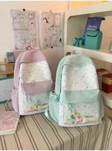 Detailed view of cute Japanese style sweet star backpacks with clear front pockets and plush charms.