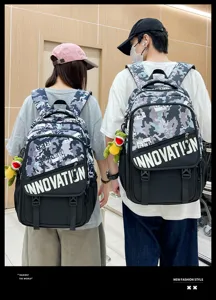 Detail shot of trendy camouflage tactical backpack with bold letter print and multi pockets.