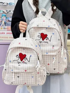 Japanese plaid school backpack detail, heart embroidery design, casual student rucksack.