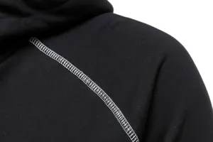 Detail shot of men women lightweight hooded sweatshirt black fabric with contrast white stitching
