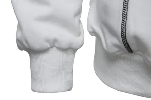 Detail view of a white hooded sweatshirt showing contrast black stitching and ribbed cuff design.