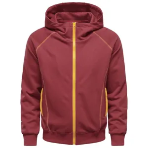 Close-up of burgundy full-zip hooded sweatshirt featuring bold yellow zipper and stitching.