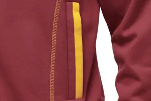 Hooded sweatshirt pocket detail close-up showcasing maroon fabric with yellow stitching.