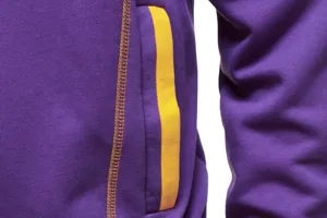 Purple hooded sweatshirt detail view featuring contrast yellow stitching and stripe accent.