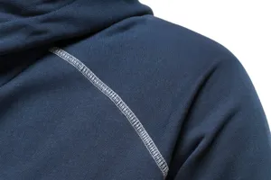 Close-up detail of dark blue hoodie shoulder featuring stylish contrast stitching.