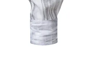 Men's long sleeve shirt cuff detail, vintage distressed silver printed pattern fabric texture.