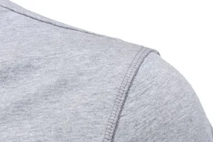 Close-up detail of grey men's long sleeve t-shirt fabric and shoulder stitching.