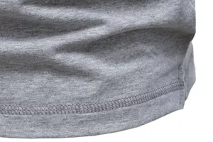 Close up detail view of men's grey cotton stretch fabric with fine stitching and soft texture.