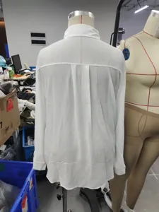 Women's white long sleeve blouse textured fabric button down casual shirt detail view