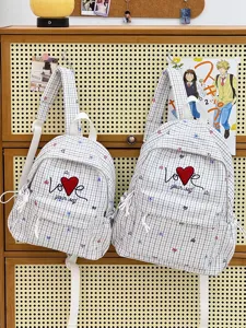 Casual plaid school backpack with heart embroidery, stylish campus daypack for students travel.