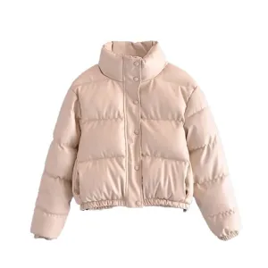 Detailed view of the beige cropped PU leather puffer jacket featuring high collar and snap buttons.