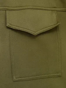 Green utility pocket detail close-up view of casual fashion women clothing twill fabric