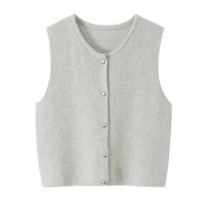 Grey knit vest detail, round neck, button front design, soft fabric texture close up