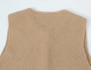 Close-up of women's casual knit vest back detail, soft khaki wool fabric texture style.
