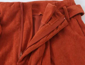 Orange corduroy trousers detail shot casual workwear stylish women apparel fashion pants