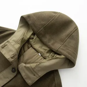 Detail shot of a stylish hooded spliced parka coat in olive green, showing collar and hood.