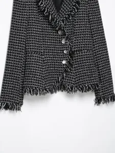 Black and white tweed blazer with fringe trim, classic lapel, and elegant metal buttons.