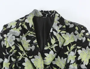 Close-up detail of women's floral jacquard blazer collar showing premium fabric texture.