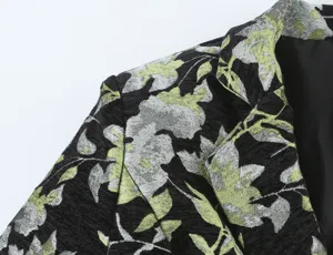 Floral jacquard blazer shoulder and lapel detail, black and metallic green fabric texture