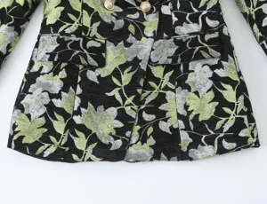 Detail view of a stylish women's floral jacquard blazer featuring elegant metallic buttons.