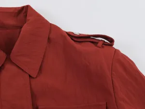 Red safari style trench coat detail, classic lapel and epaulet design for women apparel.