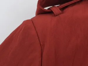Detail shot of women's safari coat shoulder fabric, exquisite stitching and button loop.