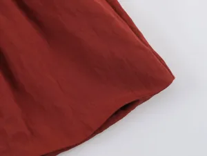 Red garment fabric detail closeup showcasing fine texture and excellent weaving quality.