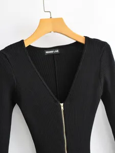 Stylish black ribbed knit long sleeve V-neck top with front zipper closure for women.