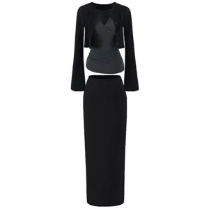Detailed view of the 3-piece women outfit featuring cardigan, camisole and skirt set.