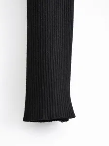 Close-up detail of black ribbed knit fabric showing fine texture, perfect for clothing accents.