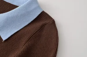 Close up view of women contrast collar ribbed knit sweater detail texture showing fabric and design.